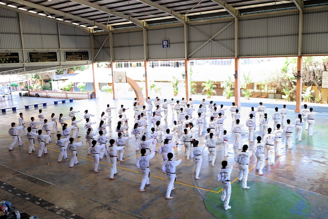 Children training martial arts together in a class, learning discipline and technique